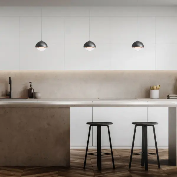 Half dark, half bright. An opaque dome shade tops a glowing sphere of light.