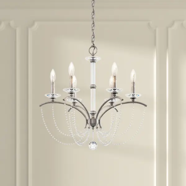 Light dances along bejeweled strands below playfully cantilevered arms for a whimsical flourish.  A statuary column of Bohemian crystal stands aloft to present a new take on Neoclassical Revival.