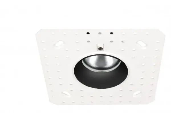 Shallow housing that is designed to fit in tight plenum spaces without sacrificing lumen output.