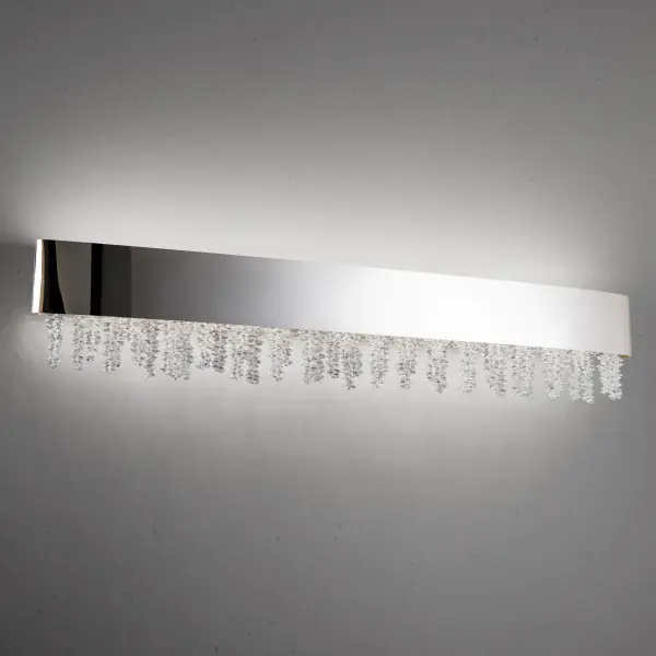 Dripping with asymmetric Optic Crystal strands suggestive of melodic scales, Soleil intimates a soothing composition of order balanced with chaos.  A beautifully finished geometry conceals modern LED optimized for color rendition.