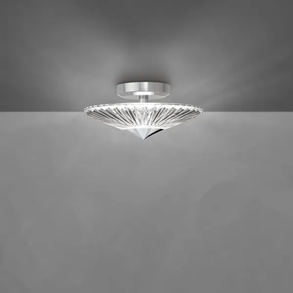 Calming and prescient, the Origami Collection proffers a simple elegance. Folds in the patterned hand-cut crystal glass shade act as prisms, bending the light to create breathtaking illumination from its integrated LEDs