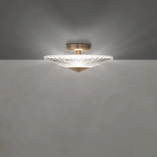 Calming and prescient, the Origami Collection proffers a simple elegance. Folds in the patterned hand-cut crystal glass shade act as prisms, bending the light to create breathtaking illumination from its integrated LEDs