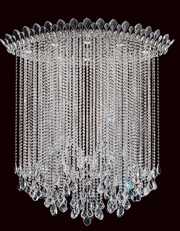 Despite being openly coquettish, Trilliane Strands shares a regal pedigree with her decorous sister. She unapologetically lets her hair down in a torrent of crystal strands beneath her crown of perched pendeloques as though with full knowledge that she is being admired.