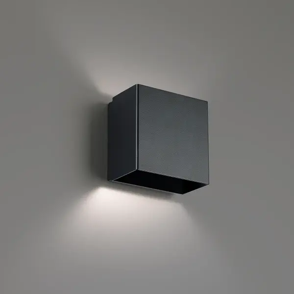 Utilitarian indirect illumination. Elevate the space. Collection: Boxi Sub-Brand: DweLED Finish: Black Notes: Boxi 5" LED Wall Sconce 2700K In Black Width: 3.00" Height: 4.75" Length: 4.75" Weight: 2.21 lb Extension from Wall: 4.75" Bulbs Included Number of Bulbs: 1 Maximum Wattage: 6.00 W Bulb Type: Module Light Source: LED Light Output: 243.00 lm Delivered Lumens: 96.00 lm Color Temperature: 2700 K CRI: 90 Dimmable Rated Average Life: 54000 Voltage: 120.00 V Material: Steel body, glass diffuser Country of Origin: China Safety Listing: ETL, cETL LED Manufacturer Warranty: 5 year