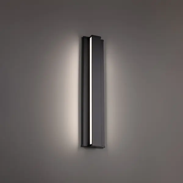 Balanced with geometric precision. A slim bar of light glowing between the lines of a minimal profile.