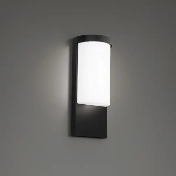A handsome tower-styled fixture provides a soft glow and refined aesthetic that is pleasing to the eyes. Perfect for illuminating modern exterior and interior spaces, the LED luminaire offers versatility in a clean, contemporary look. This versatile sconce is constructed with die-cast aluminum for durability and quality while providing ambient and down lighting through its smooth, curvaceous acrylic diffuser. Customize the color temperature of your light from 2700K warm white to 5000K cool white. - alternate view