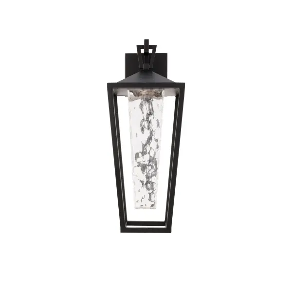 A thick hammered glass shade sends a textured glow from this modern wall lantern. An open cage frame and clean geometric accents provides added style.