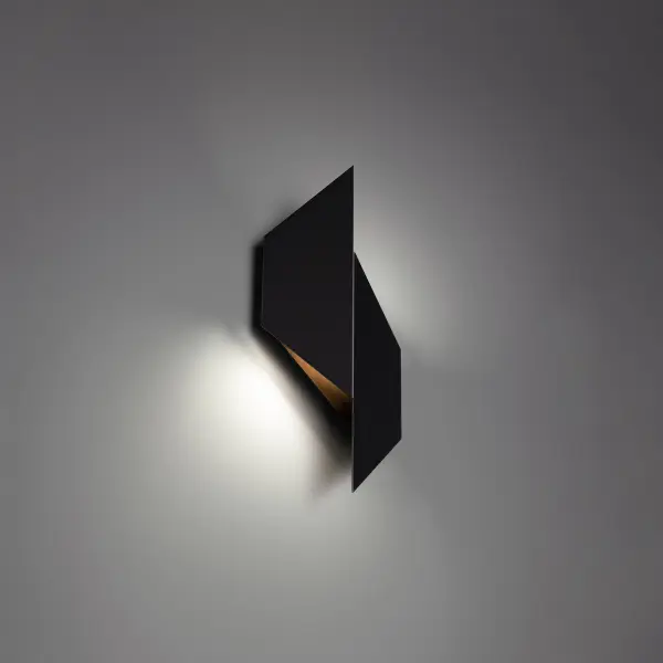Giving style a new slant. Architectural design delivering up and downward illumination from smoothly angled planes.