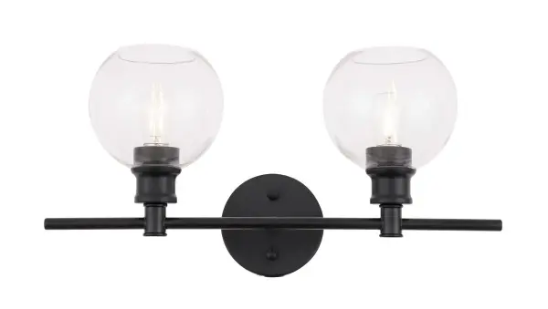 The Collier Collection of lights will be sure to have your guests admire your modern sense of style with the beautiful simplicity of its shape and form. The clean lines of the ball shaped shades create the juxtaposition of intricate simplicity, achieving a style that has both form and function. This wall lamp can be oriented facing up or down, but will always illuminate your room. Available in a brass, chrome, or black finish with either a clear or frosted ball glass shade, it is the perfect wall lamp to enhance your bathroom, foyer, or hallways, allowing you to always live a chic and fashionable lifestyle (light bulbs not included). Collection: Collier Rooms: Hallway, Living room, Bedroom, Bathroom, Entry Way, Finish: Black and Clear glass Glass: Clear Width: 8.00" Height: 9.80" Length: 19.10" Weight: 3.00 lb Wire: 11" Black and White Canopy: 4.7``x4.7``x1`` Number of Bulbs: 2 Maximum Wattage: 40.00 W Bulb Type: ST18 Bulb Base: E26 Dimmable Voltage: 110.00 V Material: Iron and Glass Country of Origin: China Safety Listing: ETL Safety Rating: Damp Title 20 Title 24 Manufacturer Warranty: 1 year limited Spec Sheet