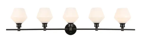 The Gene Collection of lights will be sure to have your guests admire your modern sense of style with the beautiful simplicity of its shape and form. The clean lines of the rhombus shaped shades create the juxtaposition of intricate simplicity, achieving a style that has both form and function. This wall lamp can be oriented facing up or down, but will always illuminate your room. Available in a brass, chrome, or black finish with either a clear or frosted rhombus glass shade, it is the perfect wall lamp to enhance your bathroom, foyer, or hallways, allowing you to always live in sleek contemporary style (light bulbs not included). Collection: Gene Rooms: Hallway, Living room, Bedroom, Bathroom, Entry Way, Finish: Black and Frosted white glass Glass: Frosted White Width: 8.00" Height: 10.20" Length: 47.00" Weight: 8.00 lb Wire: 11" Black and White Canopy: 4.7``x4.7``x1`` Number of Bulbs: 5 Maximum Wattage: 40.00 W Bulb Type: ST18 Bulb Base: E26 Dimmable Voltage: 110.00 V Material: Iron and Glass Country of Origin: China Safety Listing: ETL Safety Rating: Damp Title 20 Title 24 Manufacturer Warranty: 1 year limited Spec Sheet