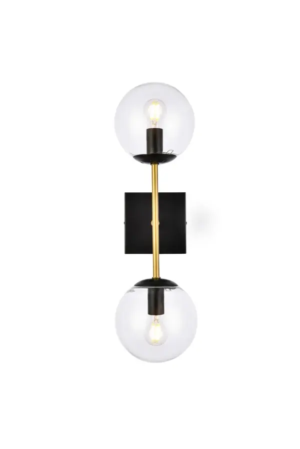 The Neri Collection wall sconce is a distinctive light that will pop in your room. The globe shade and sleek straight arm creates a clean form. The two bulbs allow themselves to brighten up the room in both directions. Available in a black and/or brass finish, and a clear or white shade, let this wall lamp illuminate your room. You can choose whether to have one or two lights. This product is dimmable and requires one or two E12 lamps. Light bulbs not included. Collection: Neri Rooms: Dining room, Living room, Bedroom, Bathroom, Entry Way, Closet Finish: Black and Brass and Clear Glass: Clear Width: 6.70" Height: 20.00" Length: 5.90" Weight: 2.00 lb Extension from Wall: 6.70" Wire: 11" Black and White Canopy: 4.7"x4.7"x1" Number of Bulbs: 2 Maximum Wattage: 40.00 W Bulb Type: E26 Bulb Base: E12 Dimmable Voltage: 110.00 V Material: Iron and Glass Country of Origin: China Safety Listing: ETL Safety Rating: Damp Title 20 Title 24 Manufacturer Warranty: 1 year limited Spec Sheet