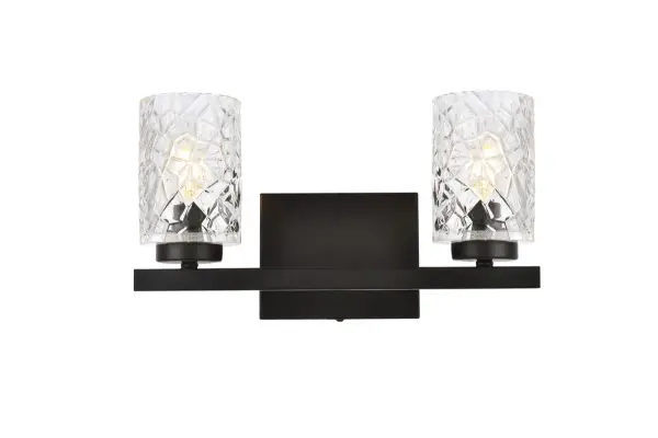 In all of its auspicious glory, the Cassie collection wall lamp will shine its felicitous light for you. As the light passes through the shade, it dances around with the shadows and puts a spotlight in your room. Whether it is in your entryway or bathrooms, this 1-light wall lamp will surely please you and your guests. Collection: Cassie Rooms: Dining room, kitchen, living room, entry way Finish: Black and Clear Shade Glass: Clear Width: 5.50" Height: 7.70" Length: 14.00" Weight: 4.00 lb Extension from Wall: 5.50" Wire: 6" Black and White Canopy: 5.9"x4.7"x0.8" Number of Bulbs: 2 Maximum Wattage: 40.00 W Bulb Type: E-12 Bulb Base: E12 Dimmable Voltage: 110.00 V Material: Metal and Glass Country of Origin: China Safety Listing: ETL Safety Rating: Damp Title 20 Title 24 Manufacturer Warranty: 1 year limited Spec Sheet