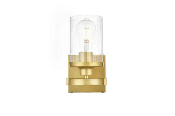 The artful allure of modern sculpture with the function of a light fixture. This glass and metal combination is a perfect example of a modern design. Compatible with dimmers, so you'll have the right amount of light in any given time of the day. Available in multiple finishes. Completely versatile, you can place this wall light as an uplight or downlight. Collection: Saanvi Rooms: Bathroom Finish: Brass and Clear Glass: Clear Width: 5.00" Height: 10.00" Weight: 2.00 lb Extension from Wall: 6.00" Wire: 8" Black and White Canopy: 4.7"x4.7"x0.8" Number of Bulbs: 1 Maximum Wattage: 40.00 W Bulb Type: E26 Bulb Base: E26 Dimmable Voltage: 110.00 V Material: Iron and Glass Country of Origin: China Safety Listing: ETL Safety Rating: Damp Title 20 Title 24 Manufacturer Warranty: 1 year limited
