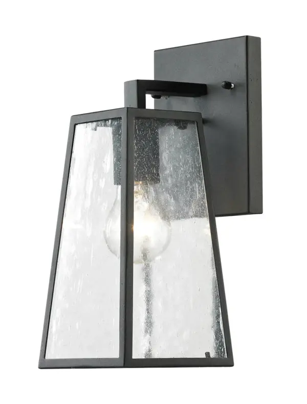 When you want soft outdoor illumination from a compact, these great-looking wall lights are perfect. The fixtures are also ETL wet-listed, making them ideal for any outdoor installation. The stylish modern light have a sturdy aluminum housing that features a protective grid across the top of the clear glass seeded diffuser. Collection: Osmond Rooms: Outdoor area, patios, deck Finish: Matte Black Width: 5.00" Height: 11.75" Length: 5.00" Weight: 2.00 lb Extension from Wall: 6.00" Number of Bulbs: 1 Maximum Wattage: 60.00 W Bulb Type: E26 Bulb Base: E26 Medium Dimmable Voltage: 120.00 V Material: steel and glass Country of Origin: China Safety Listing: ETL Safety Rating: Wet Title 20 Title 24 Manufacturer Warranty: 1 year limited Spec Sheet