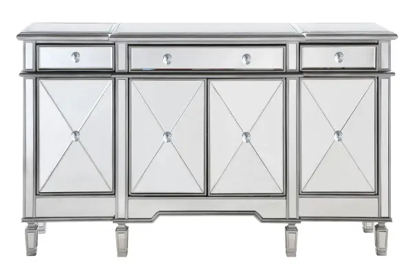 This fashionable, contemporary mirrored console, with its hand-rubbed silver finish and incised carved, tapered legs, features a slight antique touch. Its 3 mirrored drawers and 4 mirrored door fronts are enhanced with brushed steel knobs. Measuring L60" x W14" x H36", its alluring symmetry, size and shape make this piece perfect to magnify the beauty of your living room or add a touch of elegant decor to a hallway or narrow space. In addition, this attractive mirrored cabinet offers you extra storage space and a wide display area for your art objects, figurines or candle holders. (Constructed with selected kiln-dried solid wood and engineered wood panels.) Collection: Contempo Finish: Hand rubbed Antique Silver Width: 14.00" Height: 36.00" Length: 60.00" Weight: 129.00 lb Material: Solid wood and MDF Country of Origin: China Manufacturer Warranty: 1 year limited Spec Sheet