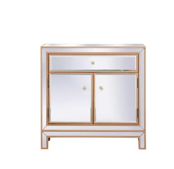 A perfect balance of contemporary style and practical utility, this chic one drawer, two doors mirror cabinet will enhance any room in your home. Featuring a hand painted gold finish, top quality mirror panels in distinctive mitered corner, jewel like crystal door knobs, it will provide you with stylish storage space you often need. Collection: Modern Rooms: living room Finish: Antique gold Width: 13.50" Height: 28.25" Length: 28.50" Weight: 55.00 lb Country of Origin: China Manufacturer Warranty: 1 year limited Spec Sheet