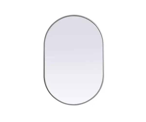 Instantly open up any space in your home with this minimalist wall-mounted mirror. Crafted of metal, this mirror strikes a pill-shaped silhouette. Its slender, clean-lined frame sports a classic finish, while the glass mirror within features a flat, for a brilliant reflection, letting the light bounce off to expand your space. Designed in a pill shape, this metal-frame mirror showcases in the three available satin finishes in black, brass, or silver. Mount this work of art in any room of your choice for added visual impact. Collection: Asha Finish: Silver Width: 24.00" Height: 36.00" Length: 36.00" Weight: 14.00 lb Material: iron and MDF Country of Origin: China Manufacturer Warranty: 1 year limited