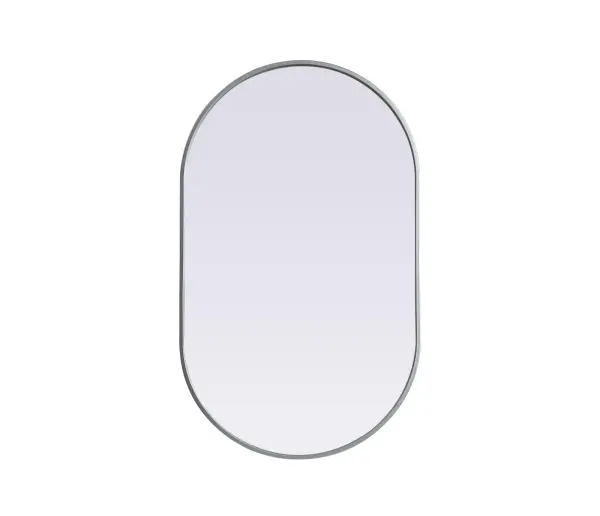 Instantly open up any space in your home with this minimalist wall-mounted mirror. Crafted of metal, this mirror strikes a pill-shaped silhouette. Its slender, clean-lined frame sports a classic finish, while the glass mirror within features a flat, for a brilliant reflection, letting the light bounce off to expand your space. Designed in a pill shape, this metal-frame mirror showcases in the three available satin finishes in black, brass, or silver. Mount this work of art in any room of your choice for added visual impact. Collection: Asha Finish: Silver Width: 24.00" Height: 40.00" Length: 40.00" Weight: 16.00 lb Material: iron and MDF Country of Origin: China Manufacturer Warranty: 1 year limited