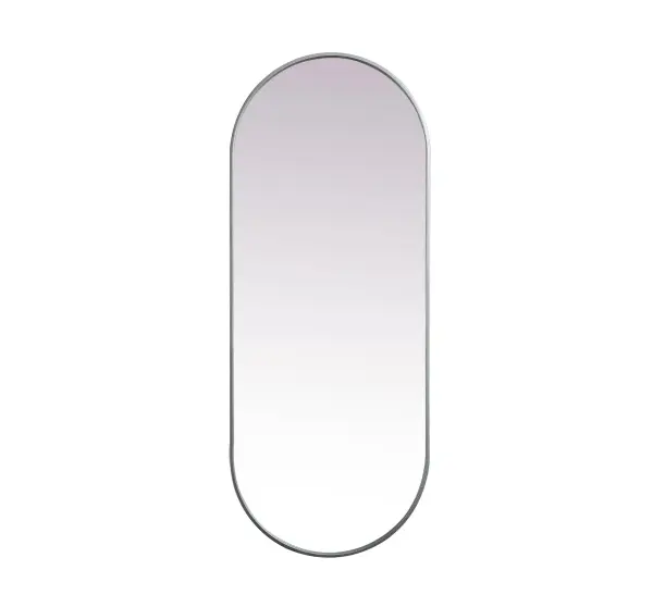 Instantly open up any space in your home with this minimalist wall-mounted mirror. Crafted of metal, this mirror strikes a pill-shaped silhouette. Its slender, clean-lined frame sports a classic finish, while the glass mirror within features a flat, for a brilliant reflection, letting the light bounce off to expand your space. Designed in a pill shape, this metal-frame mirror showcases in the three available satin finishes in black, brass, or silver. Mount this work of art in any room of your choice for added visual impact. Collection: Asha Rooms: living room, entryway, bathroom, office Finish: Silver Width: 1.00" Height: 60.00" Length: 24.00" Weight: 26.00 lb Material: iron and MDF Country of Origin: China Manufacturer Warranty: 1 year limited