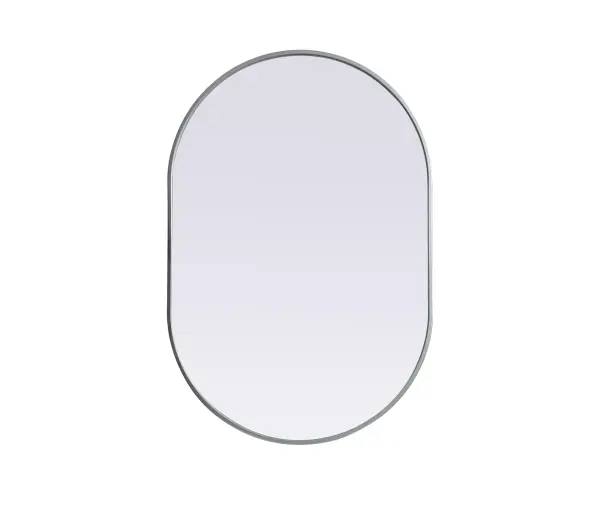 Instantly open up any space in your home with this minimalist wall-mounted mirror. Crafted of metal, this mirror strikes a pill-shaped silhouette. Its slender, clean-lined frame sports a classic finish, while the glass mirror within features a flat, for a brilliant reflection, letting the light bounce off to expand your space. Designed in a pill shape, this metal-frame mirror showcases in the three available satin finishes in black, brass, or silver. Mount this work of art in any room of your choice for added visual impact. Collection: Asha Finish: Silver Width: 27.00" Height: 40.00" Length: 40.00" Weight: 18.00 lb Material: iron and MDF Country of Origin: China Manufacturer Warranty: 1 year limited