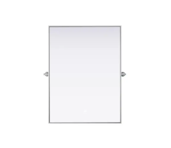 Upgrade your space with a modern pivot mirror that offers both form and function. Featuring an adjustable 8-degree tilt, this mirror allows you to customize your viewing angle for convenience and style. The iron frame with MDF backing ensures durability, while the hand-painted finish—available in black, silver, and brass—adds a touch of sophistication. Designed for versatility, this rectangular mirror can be mounted vertically or horizontally, making it the perfect fit for bathrooms, bedrooms, offices, and more. Its slim metal frame provides a sleek, contemporary aesthetic that blends seamlessly into various design styles. With included mounting brackets and screws, installation is simple and secure, giving your space an instant refresh. Whether you're getting ready for the day or enhancing your home décor, this pivot mirror delivers both style and practicality. Collection: Amoura Rooms: Bathroom Finish: Silver Width: 40.00" Height: 30.00" Weight: 26.00 lb Extension from Wall: 3.00" Material: Iron and MDF Country of Origin: China Safety Rating: Damp Manufacturer Warranty: 1 year limited