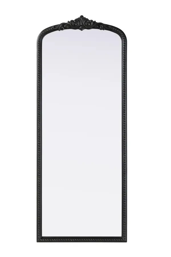 This full-length arched mirror brings a timeless, vintage-inspired charm to any space. The hand-painted vintage bronze finish and ornate crest detailing create a classic European look, perfect for traditional and French-inspired interiors. Whether leaned against the wall for a relaxed aesthetic or securely mounted using the metal inset hanger, this mirror offers versatility and refined style. Constructed from lightweight yet durable resin with an MDF backing board, it ensures long-lasting support and stability. Available in multiple sizes, this mirror is an ideal choice for bedrooms, entryways, and dressing areas, adding depth, light, and an elegant architectural presence to any room. Collection: Naomi Rooms: entry way, living room, dining room, bedroom, office Finish: Vintage Bronze Width: 24.00" Height: 60.00" Weight: 29.00 lb Material: Resin Country of Origin: Vietnam Manufacturer Warranty: 1 year limited