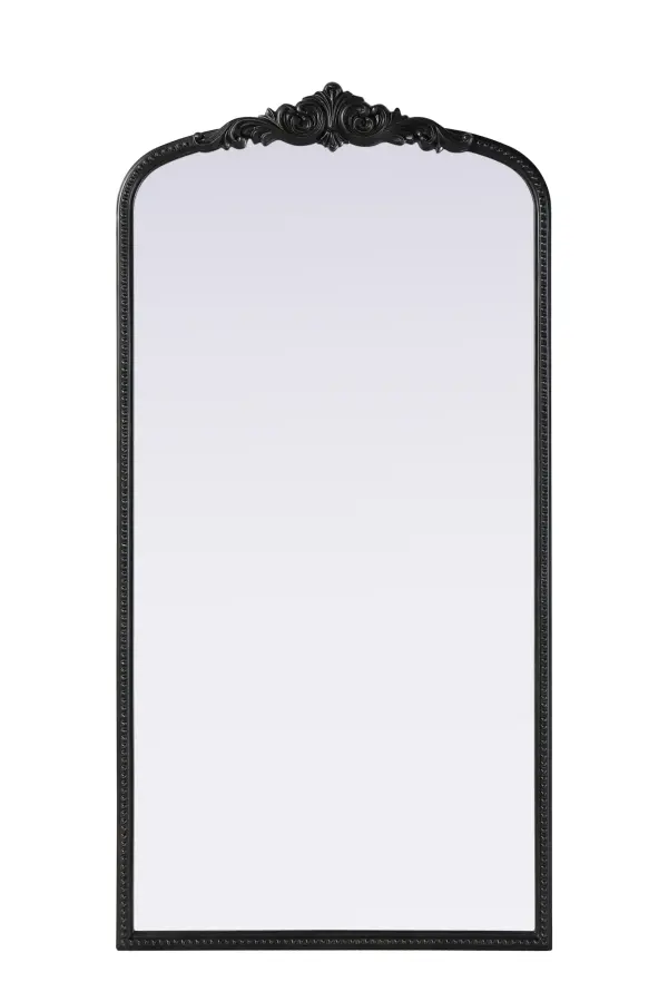 This full-length arched mirror brings a timeless, vintage-inspired charm to any space. The hand-painted vintage bronze finish and ornate crest detailing create a classic European look, perfect for traditional and French-inspired interiors. Whether leaned against the wall for a relaxed aesthetic or securely mounted using the metal inset hanger, this mirror offers versatility and refined style. Constructed from lightweight yet durable resin with an MDF backing board, it ensures long-lasting support and stability. Available in multiple sizes, this mirror is an ideal choice for bedrooms, entryways, and dressing areas, adding depth, light, and an elegant architectural presence to any room. Collection: Naomi Rooms: entry way, living room, dining room, bedroom, office Finish: Vintage Bronze Width: 36.00" Height: 72.00" Weight: 50.00 lb Material: Resin Country of Origin: Vietnam Manufacturer Warranty: 1 year limited