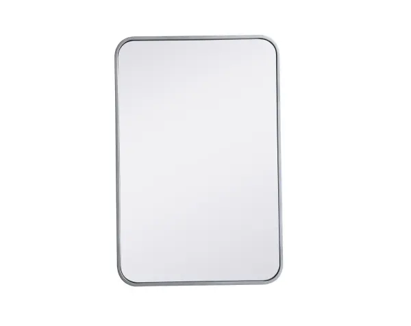 Enhance the appeal of your home or office with this modern mirror, featuring a thin rounded metal edges in a deep profile, reflecting a minimalist's design and trendy styling. To ensure your home safety, we used four metal hanger ring that are securely welded to the back of the metal frame , which sit on top of the frame for easy hanging. We recommend using suitable heavy duty picture/mirror hooks, selecting the best type of fixing for the particular wall you wish to hang the mirror on, using the appropriate rawl plug if required. Collection: Evermore Rooms: living room, entryway, bathroom, office Finish: Silver Width: 1.00" Height: 30.00" Length: 20.00" Weight: 13.00 lb Extension from Wall: 0.16" Material: iron and MDF Country of Origin: China Manufacturer Warranty: 1 year limited Spec Sheet