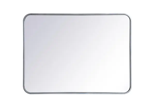 Enhance the appeal of your home or office with this modern mirror, featuring a thin rounded metal edges in a deep profile, reflecting a minimalist's design and trendy styling. To ensure your home safety, we used four metal hanger ring that are securely welded to the back of the metal frame , which sit on top of the frame for easy hanging. We recommend using suitable heavy duty picture/mirror hooks, selecting the best type of fixing for the particular wall you wish to hang the mirror on, using the appropriate rawl plug if required. Collection: Evermore Rooms: living room, entryway, bathroom, office Finish: Silver Width: 1.00" Height: 32.00" Length: 24.00" Weight: 14.00 lb Extension from Wall: 0.16" Material: iron and MDF Country of Origin: China Manufacturer Warranty: 1 year limited Spec Sheet