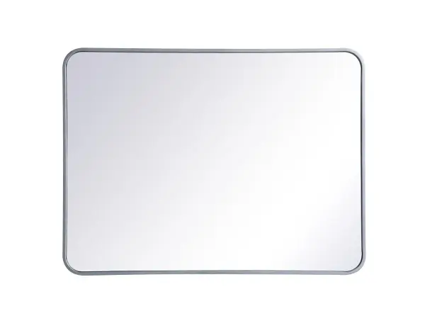 Enhance the appeal of your home or office with this modern mirror, featuring a thin rounded metal edges in a deep profile, reflecting a minimalist's design and trendy styling. To ensure your home safety, we used four metal hanger ring that are securely welded to the back of the metal frame , which sit on top of the frame for easy hanging. We recommend using suitable heavy duty picture/mirror hooks, selecting the best type of fixing for the particular wall you wish to hang the mirror on, using the appropriate rawl plug if required. Collection: Evermore Rooms: living room, entryway, bathroom, office Finish: Silver Width: 1.00" Height: 36.00" Length: 27.00" Weight: 20.00 lb Extension from Wall: 0.16" Material: iron and MDF Country of Origin: China Manufacturer Warranty: 1 year limited Spec Sheet