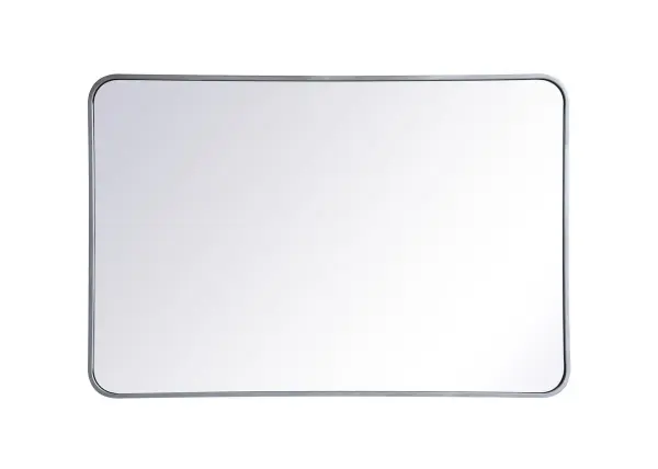 Enhance the appeal of your home or office with this modern mirror, featuring a thin rounded metal edges in a deep profile, reflecting a minimalist's design and trendy styling. To ensure your home safety, we used four metal hanger ring that are securely welded to the back of the metal frame , which sit on top of the frame for easy hanging. We recommend using suitable heavy duty picture/mirror hooks, selecting the best type of fixing for the particular wall you wish to hang the mirror on, using the appropriate rawl plug if required. Collection: Evermore Rooms: living room, entryway, bathroom, office Finish: Silver Width: 1.00" Height: 40.00" Length: 27.00" Weight: 22.00 lb Extension from Wall: 0.16" Material: iron and MDF Country of Origin: China Manufacturer Warranty: 1 year limited Spec Sheet