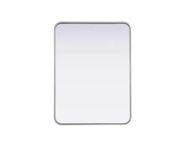 Elevate your home décor with this versatile wall mirror that combines functionality and modern design. Made from a sturdy combination of MDF, iron, and reflective mirror glass, this piece is built to last while adding a polished finish to any room. The extended depth of the frame not only provides a striking dimensional effect but also ensures the mirror's presence commands attention as a focal point. Whether you're decorating a bedroom, bathroom, or entryway, its diverse shapes—including rectangle and square—offer plenty of options to suit your style. The hand-painted black, brass, or silver finish brings a subtle yet striking touch, complemented by rounded corners for a smooth and contemporary aesthetic. With four metal inset hangers, it's ready to hang vertically or horizontally, ensuring flexibility for any layout. Available in multiple sizes, this mirror is a statement piece that blends seamlessly into both modern and classic spaces. Collection: Remy Rooms: Hallway, Living room, Bedroom, Entry Way, Office Finish: Silver Width: 24.00" Height: 32.00" Weight: 19.00 lb Extension from Wall: 2.00" Material: Iron and MDF Country of Origin: China Manufacturer Warranty: 1 year limited
