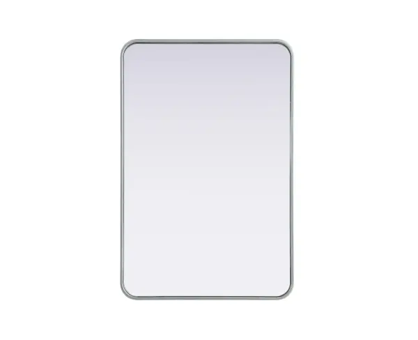Elevate your home décor with this versatile wall mirror that combines functionality and modern design. Made from a sturdy combination of MDF, iron, and reflective mirror glass, this piece is built to last while adding a polished finish to any room. The extended depth of the frame not only provides a striking dimensional effect but also ensures the mirror's presence commands attention as a focal point. Whether you're decorating a bedroom, bathroom, or entryway, its diverse shapes—including rectangle and square—offer plenty of options to suit your style. The hand-painted black, brass, or silver finish brings a subtle yet striking touch, complemented by rounded corners for a smooth and contemporary aesthetic. With four metal inset hangers, it's ready to hang vertically or horizontally, ensuring flexibility for any layout. Available in multiple sizes, this mirror is a statement piece that blends seamlessly into both modern and classic spaces. Collection: Remy Rooms: Hallway, Living room, Bedroom, Entry Way, Office Finish: Silver Width: 24.00" Height: 36.00" Weight: 21.00 lb Extension from Wall: 2.00" Material: Iron and MDF Country of Origin: China Manufacturer Warranty: 1 year limited