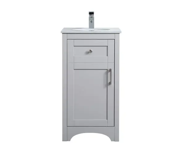 The refined simplicity of this 18" grey finish vanity creates a peaceful, yet stylish, atmosphere. Its traditional modernity adds a mature beauty that will elevate any bathroom or powder room--the Calacatta engineered marble counter top adds refined luxe while the brushed nickel handle bars open the Single cabinet door, revealing ample storage space to store and hide away an assortment of bathroom essentials. Whether your home is large or small, this vanity will surely fit in well. Collection: moore Rooms: bathroom Finish: Grey Width: 19.00" Height: 34.00" Length: 18.00" Weight: 67.00 lb Material: mdf and engineered marble and porcelain and metal Country of Origin: Vietnam Manufacturer Warranty: 1 year limited Spec Sheet