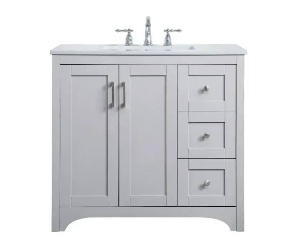 The refined simplicity of this 36" grey finish vanity creates a peaceful, yet stylish, atmosphere. Its traditional modernity adds a mature beauty that will elevate any bathroom or powder room--the Calacatta engineered marble counter top adds refined luxe while the brushed nickel handle bars open the double cabinet doors and 2 side drawers, revealing ample storage space to store and hide away an assortment of bathroom essentials. Whether your home is large or small, this vanity will surely fit in well. Collection: moore Rooms: bathroom Finish: Grey Width: 22.00" Height: 34.00" Length: 36.00" Weight: 156.00 lb Material: mdf and engineered marble and porcelain and metal Country of Origin: Vietnam Manufacturer Warranty: 1 year limited Spec Sheet