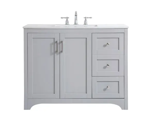 The refined simplicity of this 42" grey finish vanity creates a peaceful, yet stylish, atmosphere. Its traditional modernity adds a mature beauty that will elevate any bathroom or powder room--the Calacatta engineered marble counter top adds refined luxe while the brushed nickel handle bars open the double cabinet doors and 2 side drawers, revealing ample storage space to store and hide away an assortment of bathroom essentials. Whether your home is large or small, this vanity will surely fit in well. Collection: moore Rooms: bathroom Finish: Grey Width: 22.00" Height: 34.00" Length: 42.00" Weight: 166.00 lb Material: mdf and engineered marble and porcelain and metal Country of Origin: Vietnam Manufacturer Warranty: 1 year limited Spec Sheet