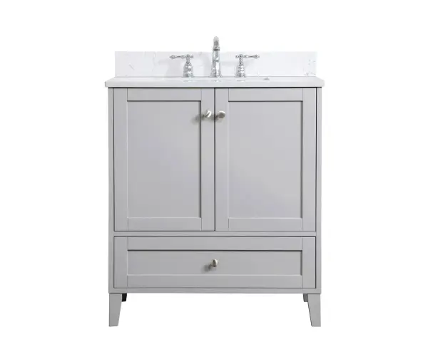 While unassuming, this 30" vanity in a grey finish sure knows how to redefine luxury. The sleek brushed nickel knobs adorn the two cabinet doors and base drawer which allows you to store your bathroom toiletries and necessities. Standing strong on oblique legs and dressed with a calacatta engineered marble countertop, this vanity will surely create beauty and casual elegance in your bathroom or powder room. Comes with a matching backsplash to complete the look and protects your wall. Collection: Sommerville Rooms: bathroom Finish: Grey Width: 19.00" Height: 34.00" Length: 30.00" Weight: 110.00 lb Material: MDF Country of Origin: Vietnam Manufacturer Warranty: 1 year limited Spec Sheet