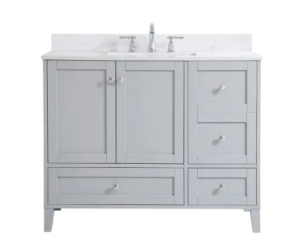 While unassuming, this 42" vanity in a grey finish sure knows how to redefine luxury. The sleek brushed nickel knobs adorn the double cabinet doors and 3 drawers which allow you to store your bathroom toiletries and necessities. Standing strong on oblique legs and dressed with a Calacatta engineered marble countertop, this vanity will surely create beauty and casual elegance in your bathroom or powder room. Comes with a matching backsplash to complete the look and protects your wall. Collection: sommerville Rooms: bathroom Finish: Grey Width: 22.00" Height: 34.00" Length: 42.00" Weight: 179.00 lb Material: MDF Country of Origin: Vietnam Manufacturer Warranty: 1 year limited Spec Sheet