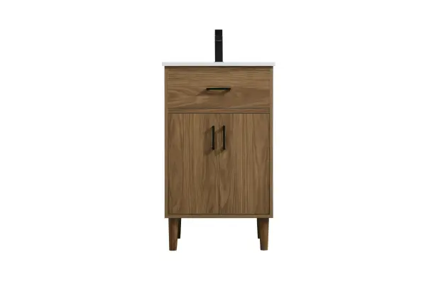 Transform your bathroom with this mid-century modern vanity, designed to bring both functionality and a sense of style to your space. Its clean lines, minimalist design, and tapered solid wood legs evoke a timeless charm, perfect for blending with modern and transitional interiors. The engineered marble countertop, with its unique faux marble veining, adds a refined, luxurious touch, while the porcelain sink is both durable and easy to maintain. Practicality meets aesthetics with a faux drawer for balanced design and a spacious double-door cabinet for efficient storage. Constructed from solid wood and MDF, this vanity offers lasting durability, while adjustable foot levelers ensure stability on any floor. Shipped mostly assembled, the solid wood legs can be effortlessly twisted into place, making installation quick and hassle-free. Collection: Chandler Rooms: bathroom Finish: Walnut Brown Width: 19.00" Height: 34.00" Length: 20.00" Weight: 61.00 lb Material: MDF and Solid wood Country of Origin: Malaysia Manufacturer Warranty: 1 year limited