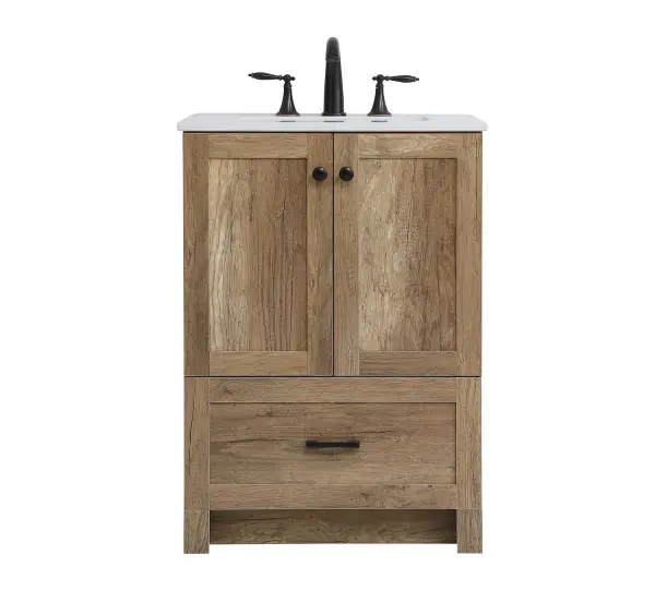 Delve into a world of minimalistic fashion and contemporary styling with this farmhouse 24" vanity. The clean faux lines anchors the weathered design. Black handle adorns the two doors hiding the base of the integrated porcelain sink while the bottom drawer allows you to store your bathroom necessities and toiletries. The compact size makes it the perfect vanity for any bathroom or powder room, regardless of size. Collection: Soma Rooms: Bathroom Finish: Natural Oak Width: 19.00" Height: 34.00" Length: 24.00" Weight: 76.00 lb Material: mdf, stone, metal Country of Origin: Vietnam Manufacturer Warranty: 1 year limited Spec Sheet