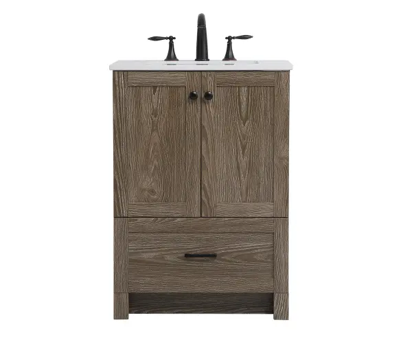 Delve into a world of minimalistic fashion and contemporary styling with this farmhouse 24" vanity. The clean faux lines anchors the weathered design. Black handle adorns the two doors hiding the base of the integrated porcelain sink while the bottom drawer allows you to store your bathroom necessities and toiletries. The compact size makes it the perfect vanity for any bathroom or powder room, regardless of size. Collection: Soma Rooms: Bathroom Finish: weathered oak Width: 19.00" Height: 34.00" Length: 24.00" Weight: 76.00 lb Material: mdf, stone, metal Country of Origin: Vietnam Manufacturer Warranty: 1 year limited Spec Sheet