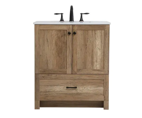 Delve into a world of minimalistic fashion and contemporary styling with this farmhouse 30" vanity. The clean faux lines anchors the weathered design. Black handle adorns the two doors hiding the base of the integrated porcelain sink while the bottom drawer allows you to store your bathroom necessities and toiletries. The compact size makes it the perfect vanity for any bathroom or powder room, regardless of size. Collection: Soma Rooms: Bathroom Finish: Natural Oak Width: 19.00" Height: 34.00" Length: 30.00" Weight: 88.00 lb Material: mdf, stone, metal Country of Origin: Vietnam Manufacturer Warranty: 1 year limited Spec Sheet