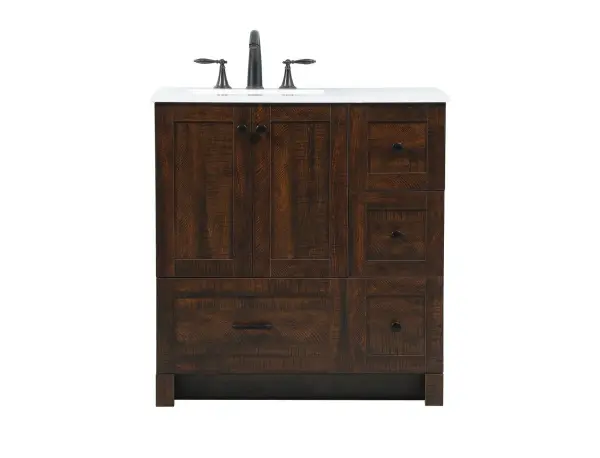 Delve into a world of minimalistic fashion and contemporary styling with this farmhouse 32" vanity. The clean faux lines anchors the weathered design. Black handle adorns the two doors hiding the base of the integrated porcelain sink while the bottom drawer and side drawers allow you to store your bathroom necessities and toiletries. The compact size makes it the perfect vanity for any bathroom or powder room, regardless of size. Collection: Soma Rooms: bathroom Finish: expresso Width: 19.00" Height: 34.00" Length: 32.00" Weight: 90.00 lb Material: MDF Country of Origin: Vietnam Manufacturer Warranty: 1 year limited