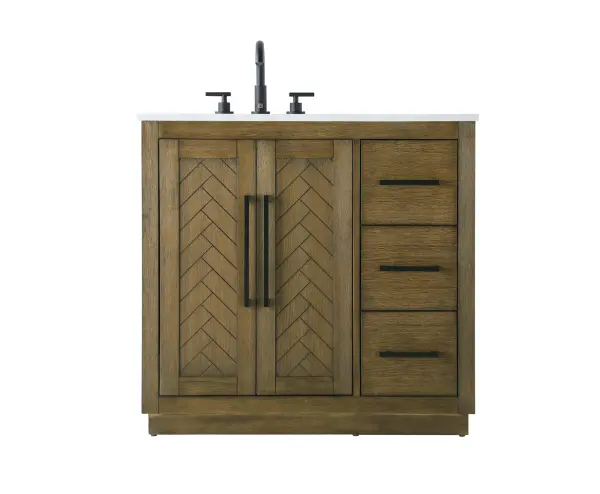 This transitional bathroom vanity offers the perfect blend of timeless style and modern functionality. Available in five refined finishes—crisp white, sleek grey, chocolate oak, honey oak, and linen oak—it complements a range of decor styles, from classic to contemporary. The stunning herringbone design on the Shaker-style door panels adds texture and craftsmanship to the piece. Topped with a white engineered marble countertop featuring subtle veining, it provides both beauty and durability. The long black metal pulls on the soft-closing doors and the thin bar pulls on the drawers add sleek, modern detailing. Practical features include a concealed overflow, a back panel cutout for easy plumbing installation, and a U-shaped cutout shelf to fit plumbing while maximizing storage space. With a toe kick all around the base, this vanity is thoughtfully designed to blend form and function in any bathroom setting. Collection: Chase Rooms: bathroom Finish: Hazel Oak Width: 21.50" Height: 34.00" Length: 36.00" Weight: 152.00 lb Material: Solid wood and MDF Country of Origin: Vietnam Manufacturer Warranty: 1 year limited