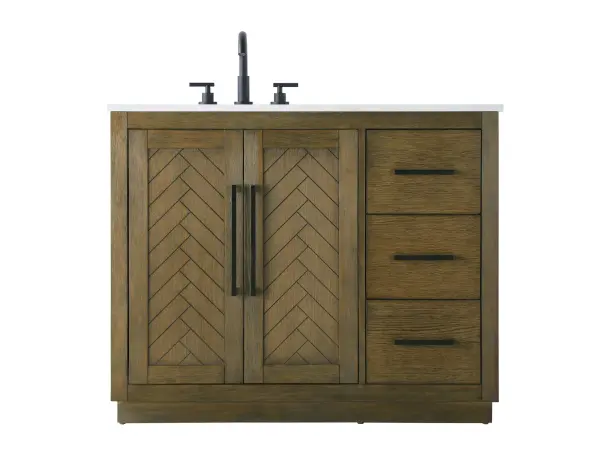 This transitional bathroom vanity offers the perfect blend of timeless style and modern functionality. Available in five refined finishes—crisp white, sleek grey, chocolate oak, honey oak, and linen oak—it complements a range of decor styles, from classic to contemporary. The stunning herringbone design on the Shaker-style door panels adds texture and craftsmanship to the piece. Topped with a white engineered marble countertop featuring subtle veining, it provides both beauty and durability. The long black metal pulls on the soft-closing doors and the thin bar pulls on the drawers add sleek, modern detailing. Practical features include a concealed overflow, a back panel cutout for easy plumbing installation, and a U-shaped cutout shelf to fit plumbing while maximizing storage space. With a toe kick all around the base, this vanity is thoughtfully designed to blend form and function in any bathroom setting. Collection: Chase Rooms: bathroom Finish: Hazel Oak Width: 21.50" Height: 34.00" Length: 42.00" Weight: 172.00 lb Material: Solid wood and MDF Country of Origin: Vietnam Manufacturer Warranty: 1 year limited