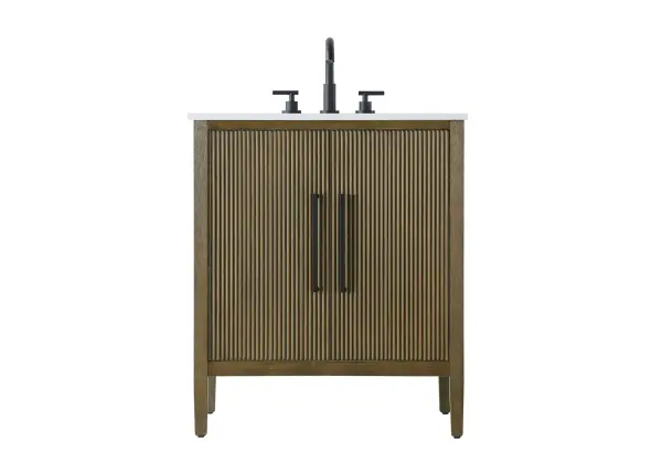 Designed with transitional elegance in mind, this bathroom vanity seamlessly blends traditional elements with modern functionality. Available in five stunning finishes, from the clean sophistication of Crisp White to the natural warmth of Honey Oak, the fluted door and drawer panels add subtle texture and charm. The white engineered marble countertop with natural veining exudes luxury, while the soft-closing doors with sleek black metal pulls offer a quiet, refined experience. Practicality is never compromised, with features like the U-shaped shelf for plumbing, and pre-drilled faucet holes for easy customization. Whether your style leans modern or classic, this vanity is the perfect balance of beauty and function, appealing to customers with a taste for quality and style. Collection: Blakely Rooms: bathroom Finish: Hazel Oak Width: 21.50" Height: 35.00" Length: 30.00" Weight: 96.00 lb Material: Solid wood and MDF Country of Origin: Vietnam Manufacturer Warranty: 1 year limited