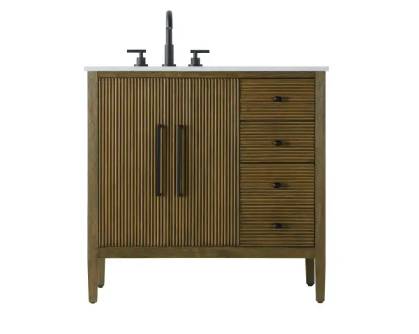 Designed with transitional elegance in mind, this bathroom vanity seamlessly blends traditional elements with modern functionality. Available in five stunning finishes, from the clean sophistication of Crisp White to the natural warmth of Honey Oak, the fluted door and drawer panels add subtle texture and charm. The white engineered marble countertop with natural veining exudes luxury, while the soft-closing doors and drawers with sleek black metal pulls offer a quiet, refined experience. Practicality is never compromised, with features like the U-shaped shelf for plumbing, deeper bottom drawer for ample storage, and pre-drilled faucet holes for easy customization. Whether your style leans modern or classic, this vanity is the perfect balance of beauty and function, appealing to customers with a taste for quality and style. Collection: Blakely Rooms: bathroom Finish: Hazel Oak Width: 21.50" Height: 34.00" Length: 36.00" Weight: 140.00 lb Material: Solid wood and MDF Country of Origin: Vietnam Manufacturer Warranty: 1 year limited