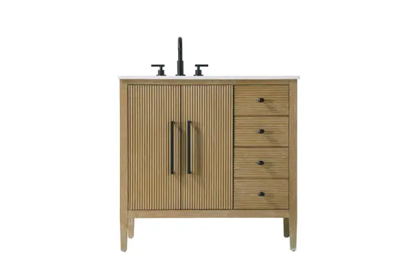 Designed with transitional elegance in mind, this bathroom vanity seamlessly blends traditional elements with modern functionality. Available in five stunning finishes, from the clean sophistication of Crisp White to the natural warmth of Honey Oak, the fluted door and drawer panels add subtle texture and charm. The white engineered marble countertop with natural veining exudes luxury, while the soft-closing doors and drawers with sleek black metal pulls offer a quiet, refined experience. Practicality is never compromised, with features like the U-shaped shelf for plumbing, deeper bottom drawer for ample storage, and pre-drilled faucet holes for easy customization. Whether your style leans modern or classic, this vanity is the perfect balance of beauty and function, appealing to customers with a taste for quality and style. Collection: Blakely Rooms: bathroom Finish: Linen Oak Width: 21.50" Height: 34.00" Length: 36.00" Weight: 140.00 lb Material: Solid wood and MDF Country of Origin: Vietnam Manufacturer Warranty: 1 year limited