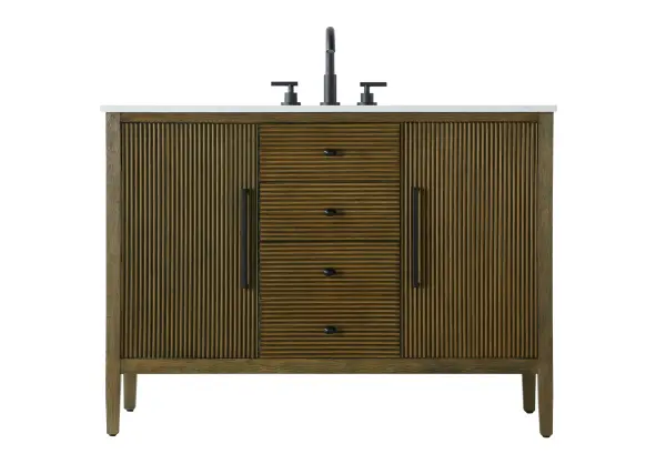 Designed with transitional elegance in mind, this bathroom vanity seamlessly blends traditional elements with modern functionality. Available in five stunning finishes, from the clean sophistication of Crisp White to the natural warmth of Honey Oak, the fluted door and drawer panels add subtle texture and charm. The white engineered marble countertop with natural veining exudes luxury, while the soft-closing doors and drawers with sleek black metal pulls offer a quiet, refined experience. Practicality is never compromised, with features like the U-shaped shelf for plumbing, deeper bottom drawer for ample storage, and pre-drilled faucet holes for easy customization. Whether your style leans modern or classic, this vanity is the perfect balance of beauty and function, appealing to customers with a taste for quality and style. Collection: Blakely Rooms: bathroom Finish: Hazel Oak Width: 21.50" Height: 34.00" Length: 48.00" Weight: 177.00 lb Material: Solid wood and MDF Country of Origin: Vietnam Manufacturer Warranty: 1 year limited