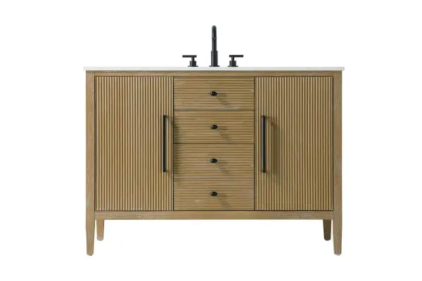 Designed with transitional elegance in mind, this bathroom vanity seamlessly blends traditional elements with modern functionality. Available in five stunning finishes, from the clean sophistication of Crisp White to the natural warmth of Honey Oak, the fluted door and drawer panels add subtle texture and charm. The white engineered marble countertop with natural veining exudes luxury, while the soft-closing doors and drawers with sleek black metal pulls offer a quiet, refined experience. Practicality is never compromised, with features like the U-shaped shelf for plumbing, deeper bottom drawer for ample storage, and pre-drilled faucet holes for easy customization. Whether your style leans modern or classic, this vanity is the perfect balance of beauty and function, appealing to customers with a taste for quality and style. Collection: Blakely Rooms: bathroom Finish: Linen Oak Width: 21.50" Height: 34.00" Length: 48.00" Weight: 177.00 lb Material: Solid wood and MDF Country of Origin: Vietnam Manufacturer Warranty: 1 year limited